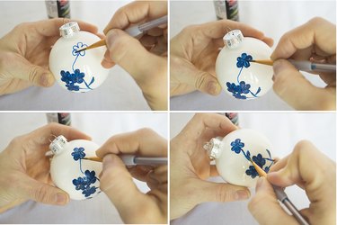 Filling in flower and drawing stem with leaf.