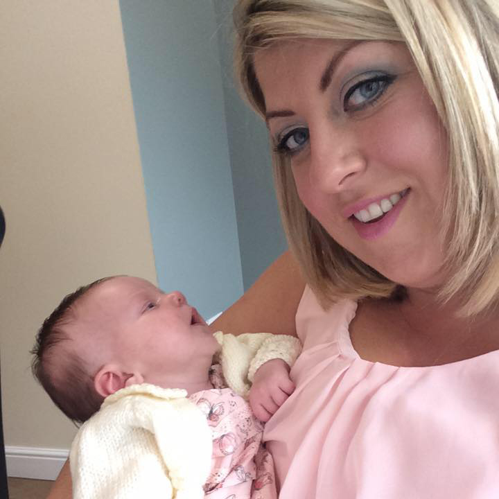 claire henderson holding baby daughter